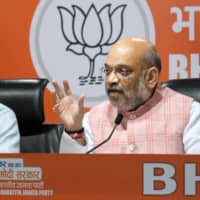 Indian Prime Minister Narendra Modi, Bharatiya Janata Party President Amit Shah and other BJP leaders attend a news conference at party  headquarters in New Delhi on May 17. | BLOOMBERG