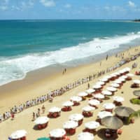 An event is held Sunday to thank volunteers cleaning the beaches after an oil spill on Maracaipe beach in Ipojuca, Pernambuco state, Brazil. | REUTERS