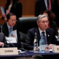 China\'s Foreign Minister Wang Yi and Canada\'s Foreign Minister Francois-Philippe Champagne attend the G20 foreign ministers\' meeting in Nagoya on Saturday. | REUTERS