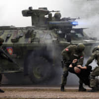 Serbian police perform during a joint anti-terrorist drill in the Zelezara Smederevo steel mill, in the city of Smederevo, 45 km east of Belgrade, Thursday. Serbian and Chinese security forces are holding joint anti-terrorist drills in the Balkan country in a sign of Beijing\'s increasing influence in the volatile region. | AP