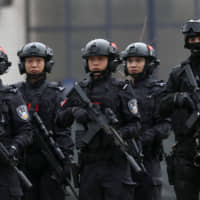 Serbian and Chinese security forces perform a joint anti-terrorist drill in the Zelezara Smederevo steel mill, in the city of Smederevo, 45 km east of Belgrade, on Thursday. | AP