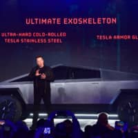 Tesla CEO Elon Musk unveils the Cybertruck in Hawthorne, California, on Thursday. | AFP-JIJI