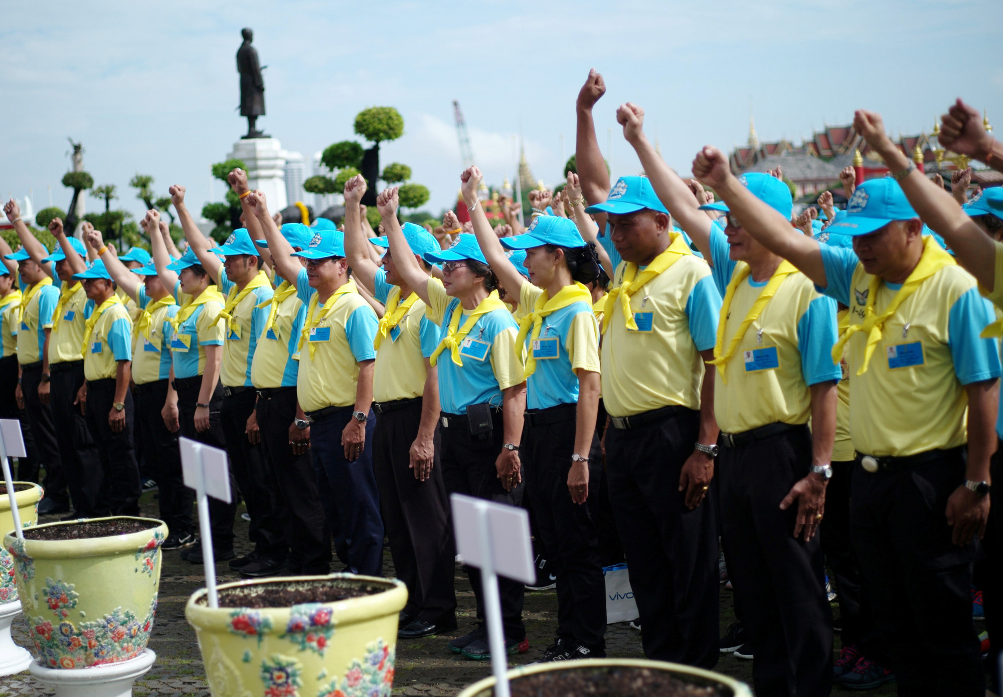 Volunteer Spirit members, including those who went for the 904 training course, line up ahead of performing community service at a Buddhist temple in Bangkok on Oct. 14. | REUTERS