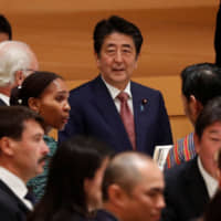 Prime Minister Shinzo Abe hosts a banquet for newly enthroned Emperor Naruhito at the Hotel New Otani in Tokyo on Oct. 23. | REUTERS