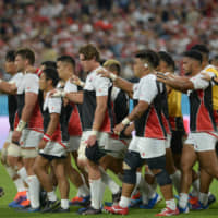 Captain Michael Leitch leads Japan\'s rugby team back to the locker room before the kickoff of the Japan-Samoa game on Oct. 5. | DAN ORLOWITZ