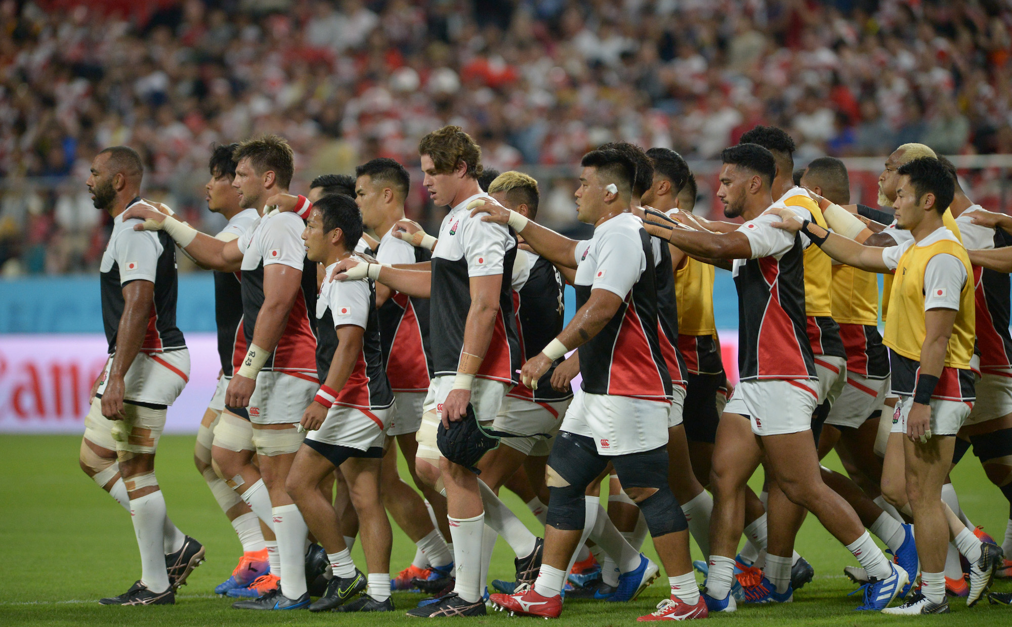 Captain Michael Leitch leads Japan's rugby team back to the locker room before the kickoff of the Japan-Samoa game on Oct. 5. | DAN ORLOWITZ