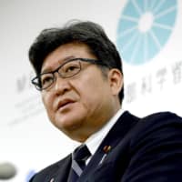 Education minister Koichi Hagiuda speaks at a news conference held at the ministry on Nov. 1 about postponing the launch of private-sector English proficiency tests for the standardized university entrance exam. | KYODO