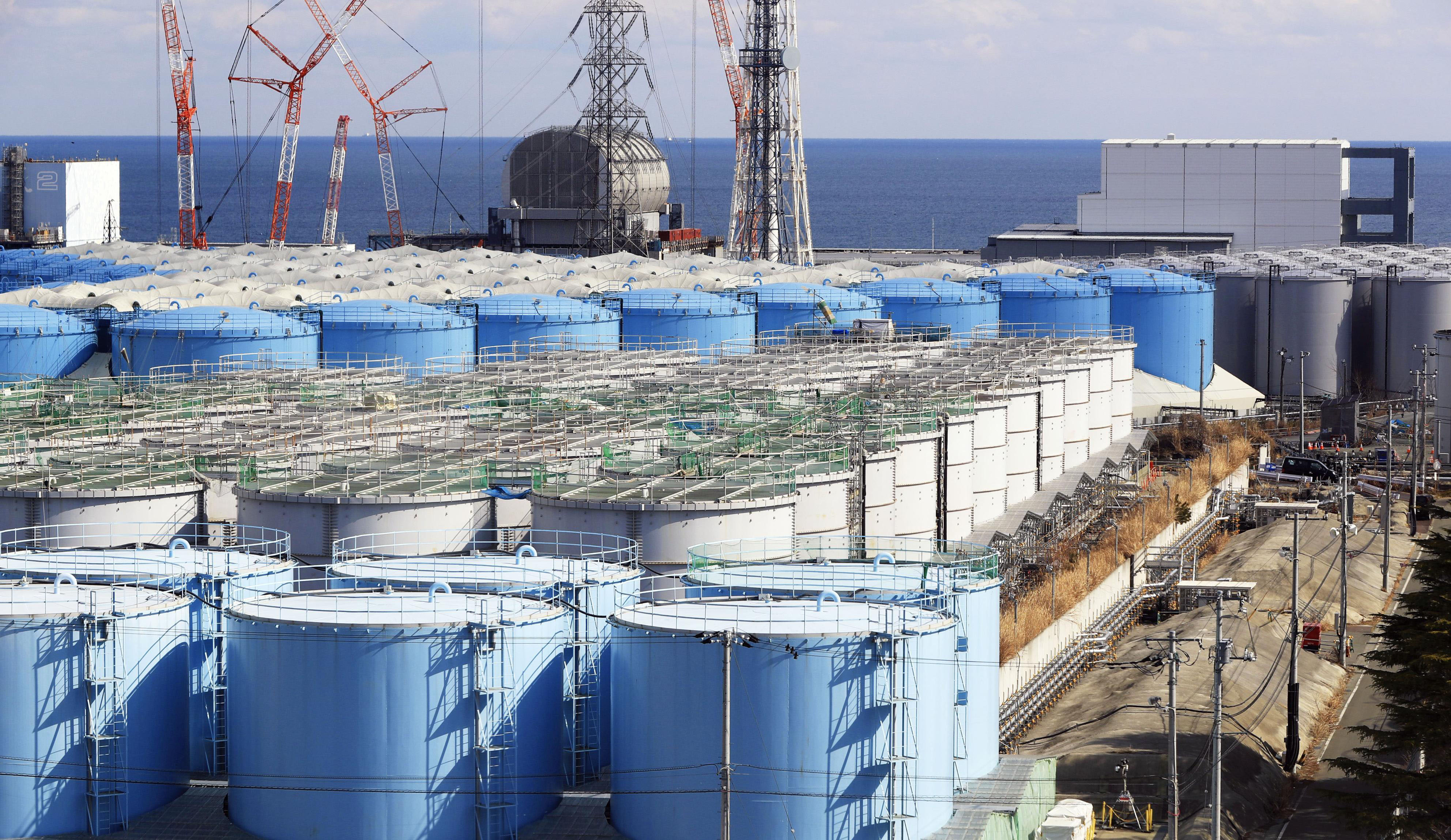 Contaminated water is stored in tanks at the Fukushima No. 1 nuclear power plant in Okuma, Fukushima Prefecture, in February. | POOL / VIA KYODO
