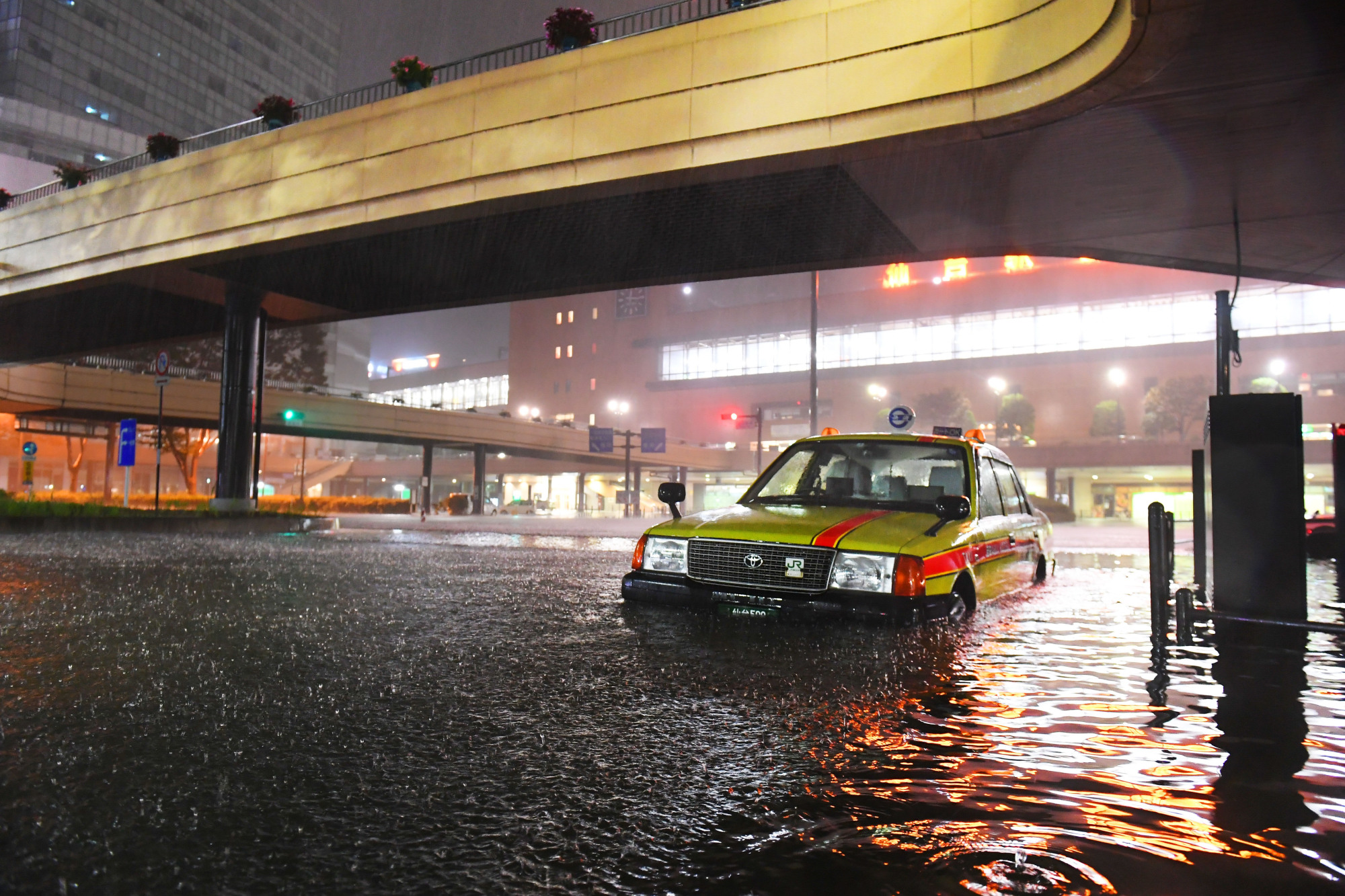 A street in Sendai is flooded on Oct. 13 after Typhoon Hagibis caused heavy rain in the area. | KAHOKU SHIMPO