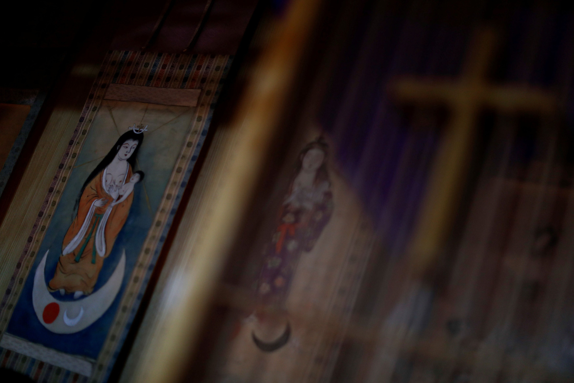 Images of the Virgin Mary are seen at the home of Masaichi Kawasaki, 69, a descendant of the 'Hidden Christians,' on Ikitsuki Island, Nagasaki Prefecture, on Nov. 4. Japan's 'Kakure Kirishitan,' or Hidden Christians, preserved their faith in secret during centuries of persecution. | REUTERS