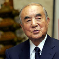 Former Prime Minister Yasuhiro Nakasone speaks during an interview at his office in Tokyo in November 2005. | REUTERS