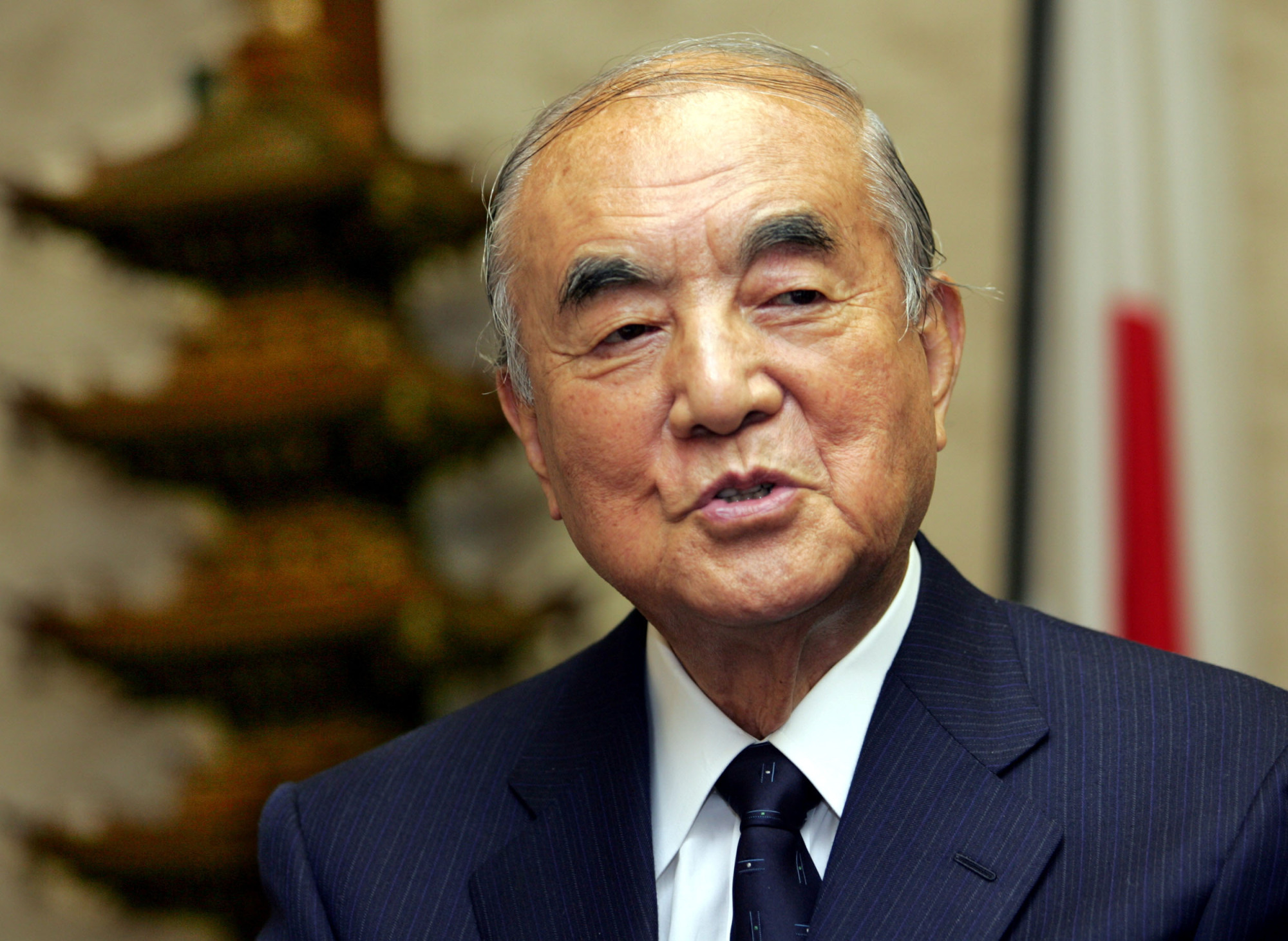 Former Prime Minister Yasuhiro Nakasone speaks during an interview at his office in Tokyo in November 2005. | REUTERS