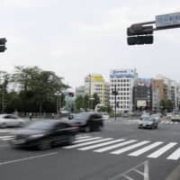 A crossing in Tokyo\'s Chiyoda Ward where a police car hit a 4-year-old boy in August. | KYODO