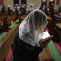 Worshipers attend an early morning Mass at the Urakami Cathedral in the city of Nagasaki on Nov. 17.  | AP