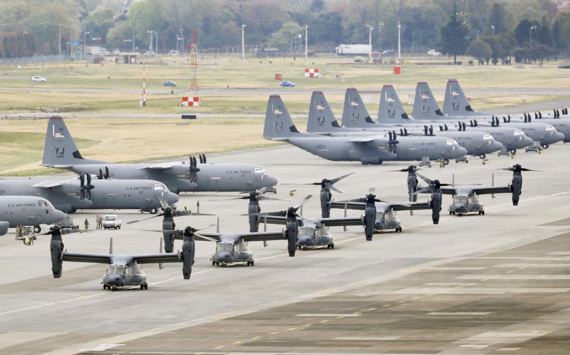 Five U.S. Air Force CV-22 Ospreys land at Yokota Air Base in Tokyo on April 5, 2018. | KYODO