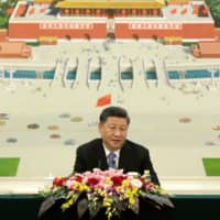 Chinese President Xi Jinping speaks during a meeting with delegates from the 2019 New Economy Forum at the Great Hall of the People in Beijing on Friday. | POOL / VIA AFP-JIJI