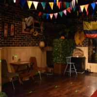 Hit the dance floor: A Colombian flag hangs on the wall of Latin Bar Salsa in Fukuoka\'s Tenjin neighborhood. | IRINA GRIGOROVICI