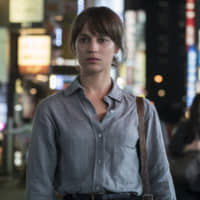 Tokyo drifter: Alicia Vikander gives a convincing linguistic performance as a translator suspected of murder in Wash Westmoreland\'s \"Earthquake Bird.\" | MURRAY CLOSE/NETFLIX