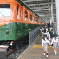 School children enjoy the Promenade, which displays trains from different eras at the Kyoto Railway Museum. | JASON JENKINS