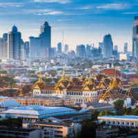 City of smiles, city of contrasts: Bangkok\'s Grand Palace is in direct contrast with the city\'s rapidly growing skyline | GETTY IMAGES
