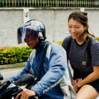 Daily necessity: Beat the notorious Bangkok traffic by riding a moto taxi around the city. The drivers are skilled, and cut through the traffic by alarmingly narrow margins. | OSCAR BOYD
