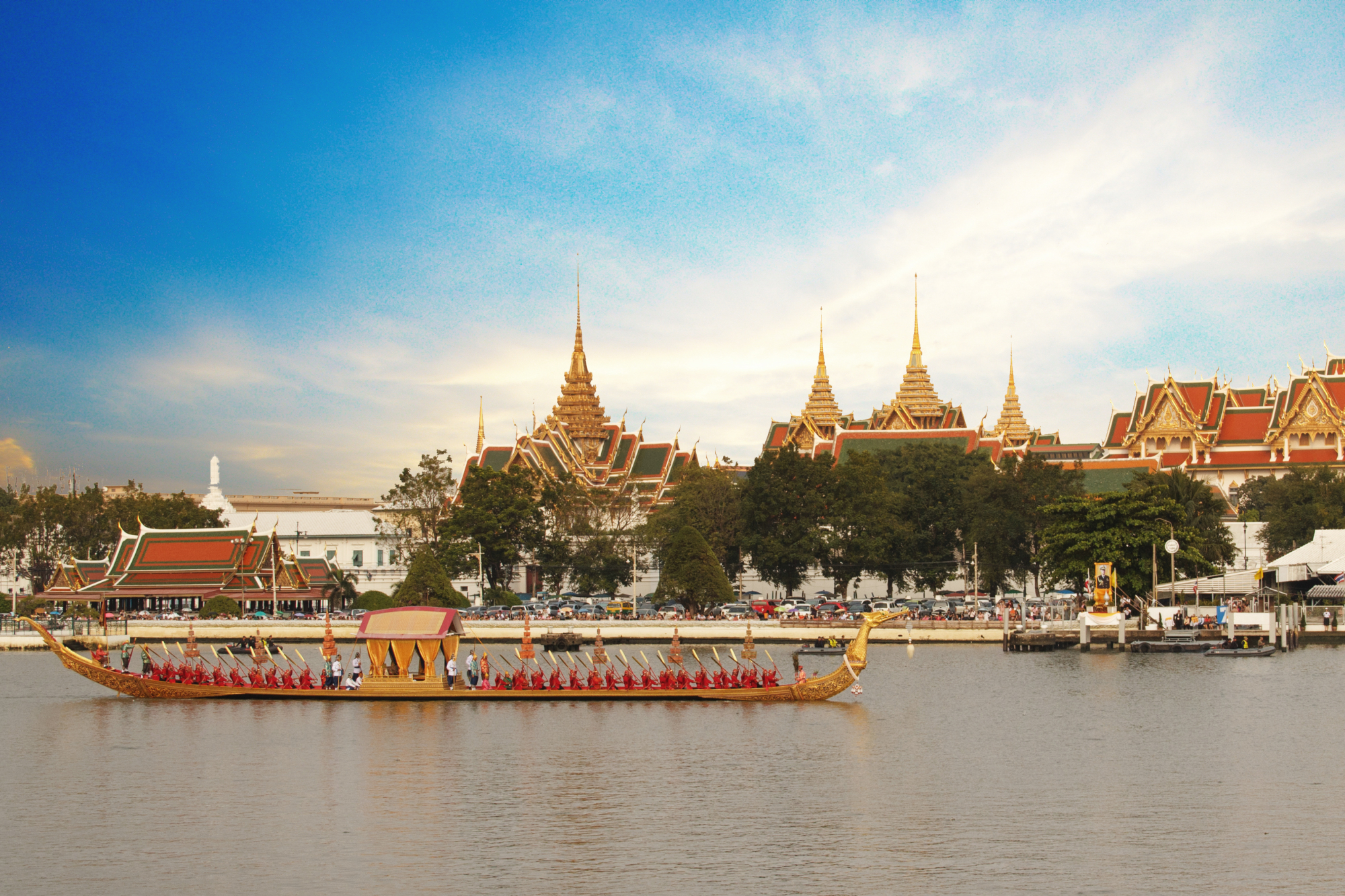 What fun: A barge passes in front of Wat Pho, which sits on the banks of Bangkok's Chao Phraya River. | GETTY IMAGES