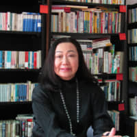 Reading is fundamental: Yuko Yamashita sits in the Japanese library she created out of an office in Barcelona. | ANNETTE PACEY