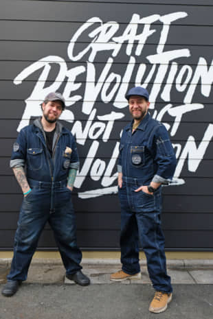 Denim-clad pioneers: Tokyo Aleworks head brewer Bob Stockwell (right) and production adviser Randy Carncross pose outside the premises. | CLAIRE WILLIAMSON