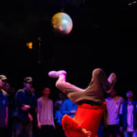 A world turned upside down: A break dancer performs at the Vibration Urbaines Japan Cypher qualifier in Tokyo in July. | DAN SZPARA