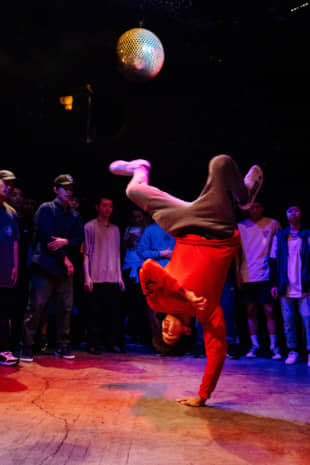 A world turned upside down: A break dancer performs at the Vibration Urbaines Japan Cypher qualifier in Tokyo in July. | DAN SZPARA