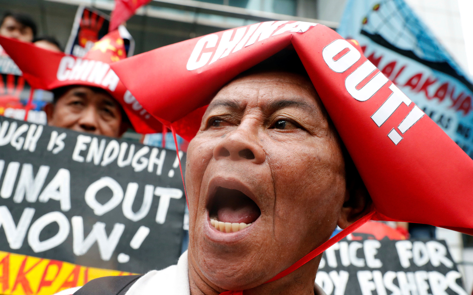 People in Manila protest Chinese harassment of Filipino fishing crews in the South China Sea in June 2018. | REUTERS