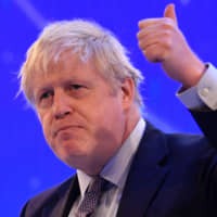British Prime Minister Boris Johnson addresses the annual Confederation of British Industry in London on Monday. The U.K. general election will be held Dec. 12. | AFP-JIJI