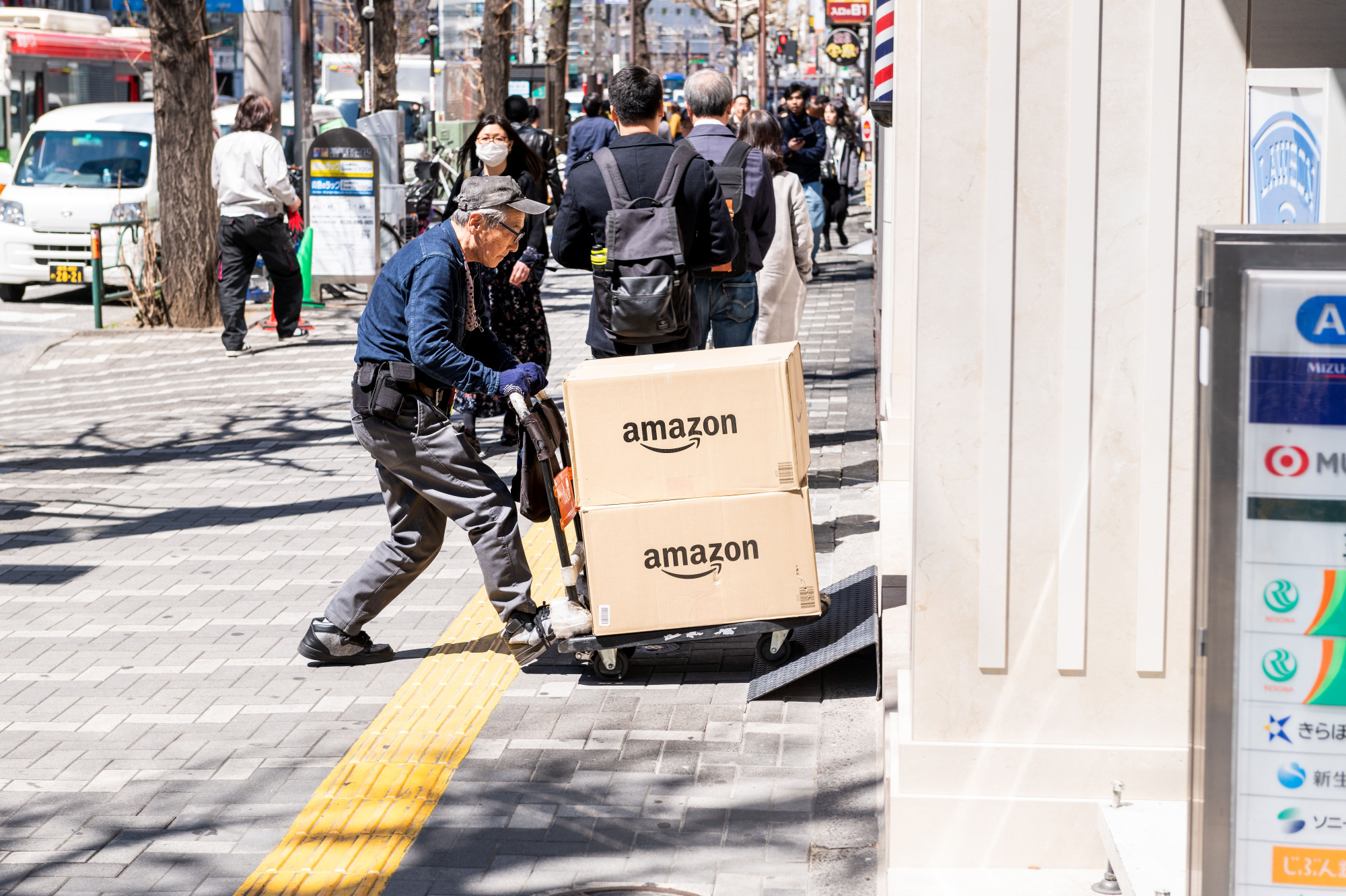 An elderly man delivers packages in Tokyo. By 2030, one out of three Japanese will be 65 or older. | GETTY IMAGES