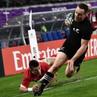 New Zealand\'s Ben Smith scores a try against Wales in the Rugby World Cup bronze-medal match on Friday night at Tokyo Stadium. | AFP-JIJI