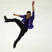 France\'s Kevin Aymoz is in second after the men\'s short program with a score of 91.47. | AP