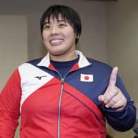 Grand Slam Osaka over-78-kg division women\'s winner Akira Sone poses for a photo on Sunday at Maruzen Intec Arena Osaka. | KYODO