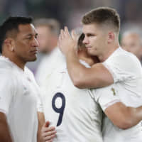 England captain Owen Farrell (right) consoles teammate Ben Youngs after their loss in the Rugby World Cup final on Saturday in Yokohama. | REUTERS