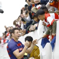 Kintetsu Liners lock Luke Thompson signs autographs for fans after his final home game with the Top Challenge League club on Sunday at Hanazono Rugby Stadium in Higashiosaka, Osaka Prefecture. | KYODO