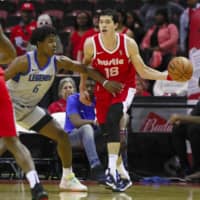 Memphis Hustle swingman Yuta Watanabe dribbles the ball in the first quarter as Jaylen Hoard of the Texas Legends defends him in the teams\' NBA G League opener in Southaven, Mississippi. | KYODO