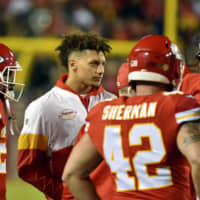Kansas City Chiefs QB Patrick Mahomes, seen here in street clothes during last month\'s game against Green Bay, practiced fully Wednesday for the first time since dislocating his knee. | AP