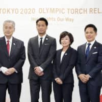 Athens Olympic marathon winner Mizuki Noguchi (second from right), seen at a Monday news conference announcing details regarding the Tokyo 2020 torch relay, will be the first Japanese runner to carry the flame during the Greek leg of the relay. | KYODO