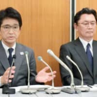 Japan Tennis Association executive Tsuyoshi Fukui (left), seen in a May 2017 file photo, also serves as the Japanese Olympic Committee secretary general. | KYODO