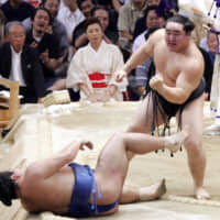 Then-yokozuna Asashoryu reacts after beating Tochiazuma for his fifth straight championship at the 2005 Nagoya Basho at Aichi Prefectural Gymnasium. | KYODO