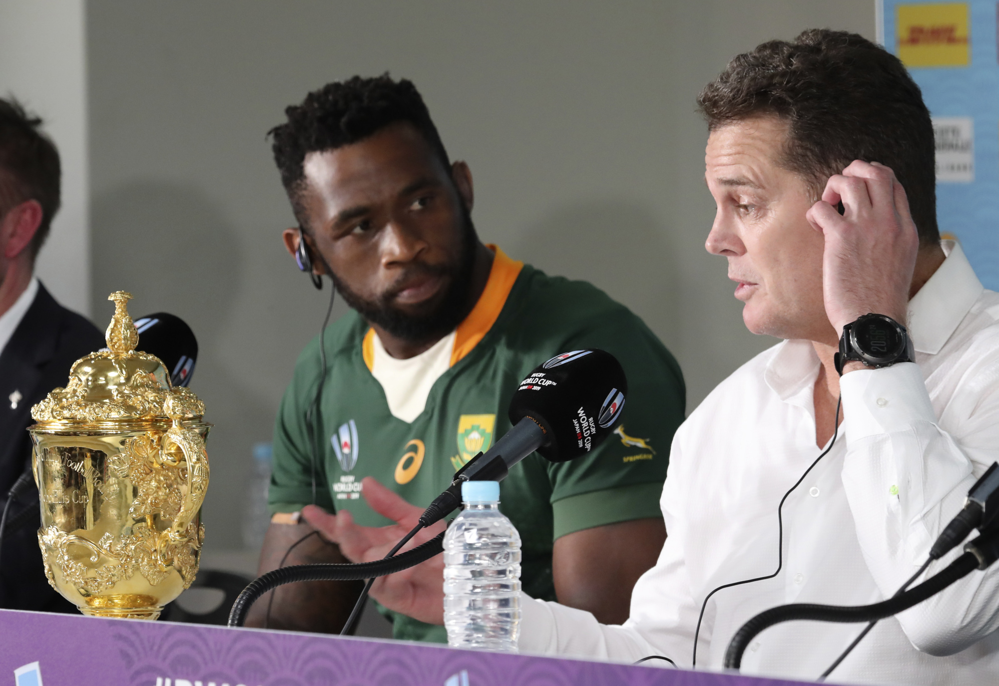 South Africa's Siya Kolisi looks at coach Rassie Erasmus at a news conference after the team defeated England in the Rugby World Cup final at International Yokohama Stadium in the city on Saturday. | AP