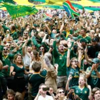 South Africans celebrate after the country won the Rugby World Cup 2019 final against and England at International Stadium Yokohama, at the Loftus Park fan zone on Saturday. | AFP-JIJI