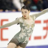 Rika Kihira performs her free skate routine at the NHK Trophy on Saturday en route to a second-place finish. | KYODO