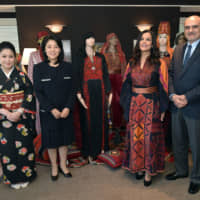 Palestine-Japan Blending Traditional Costumes exhibition was co-organized by the General Misson of Palestine and International Cultural Exchange Japan (ICEJ). Palestinian Ambassador Waleed Siam (right ) and his wife Maali Siam　(second from right ) with Kaori Kono, wife of Minister of Defense Taro Kono (second from left) and ICEJ President Maki Yamamoto-Arakawa (left ) at Hotel Allamanda Aoyama on Nov. 6. | YOSHIAKI MIURA