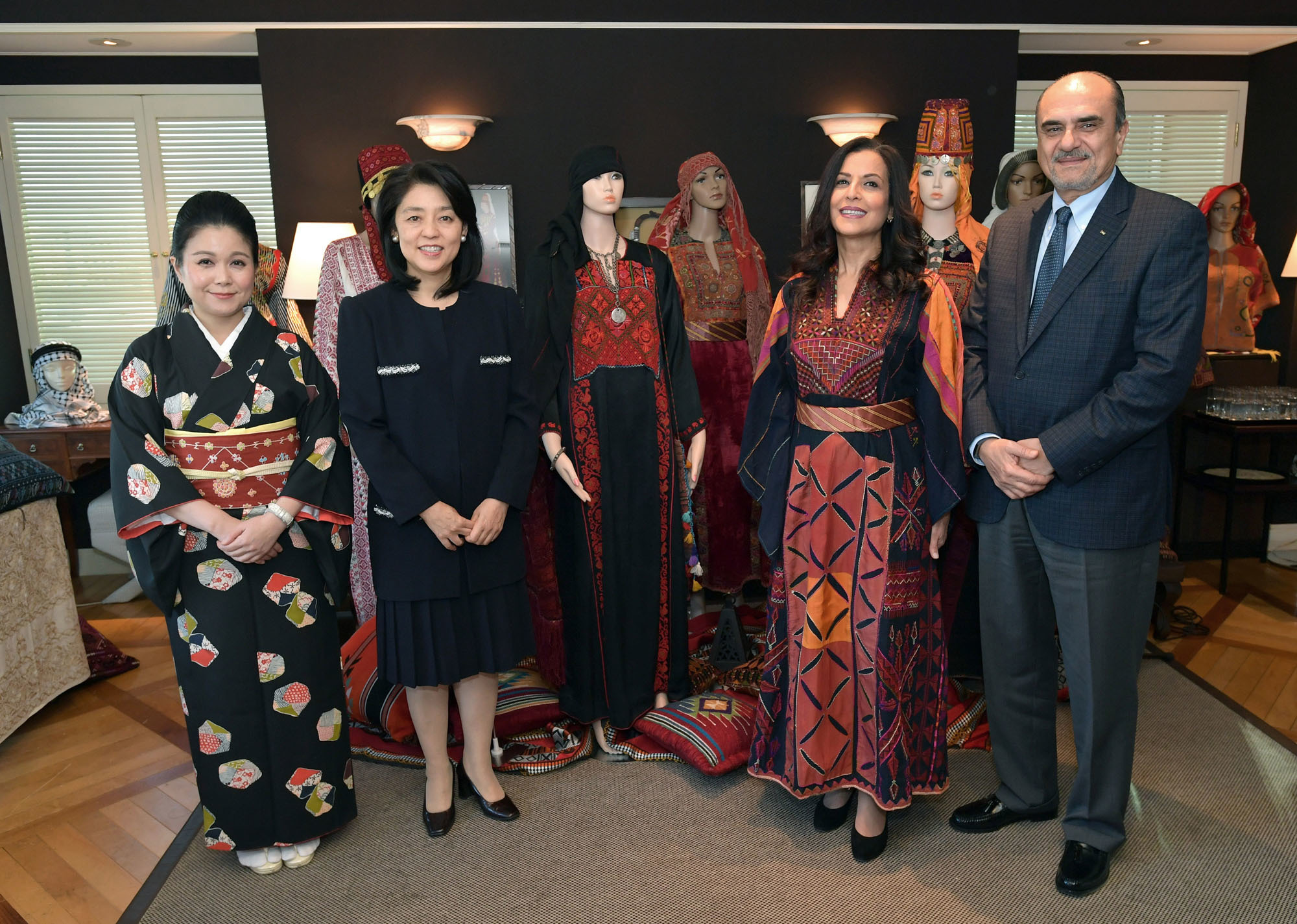 Palestine-Japan Blending Traditional Costumes exhibition was co-organized by the General Misson of Palestine and International Cultural Exchange Japan (ICEJ). Palestinian Ambassador Waleed Siam (right ) and his wife Maali Siam (second from right ) with Kaori Kono, wife of Minister of Defense Taro Kono (second from left) and ICEJ President Maki Yamamoto-Arakawa (left ) at Hotel Allamanda Aoyama on Nov. 6. yoshiaki miura | 
