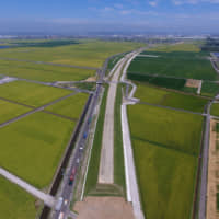 A berm for a road that was further elevated for protection from tsunami in Sendai\'s Arahama Ohori area. | SENDAI CITY