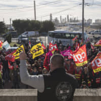 CGT union leader Olivier Mateu gives a speech to union members at a petrochemical factory where workers have been striking, Saturday in Martigues, southern France. French President Emmanuel Macron suggested Thursday he was ready to make changes to his plans to overhaul the pension system as a major union warned that nationwide strikes and protests could continue unabated until Christmas. | AP